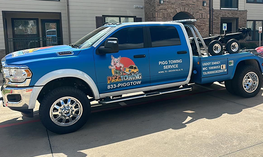 Pigg Towing blue tow truck